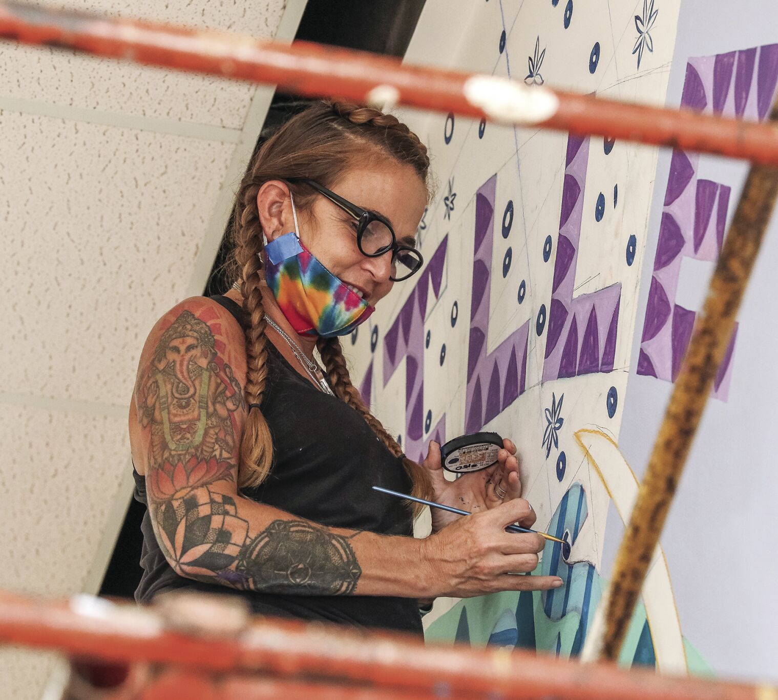 Artist paints inspirational murals at RH Mall